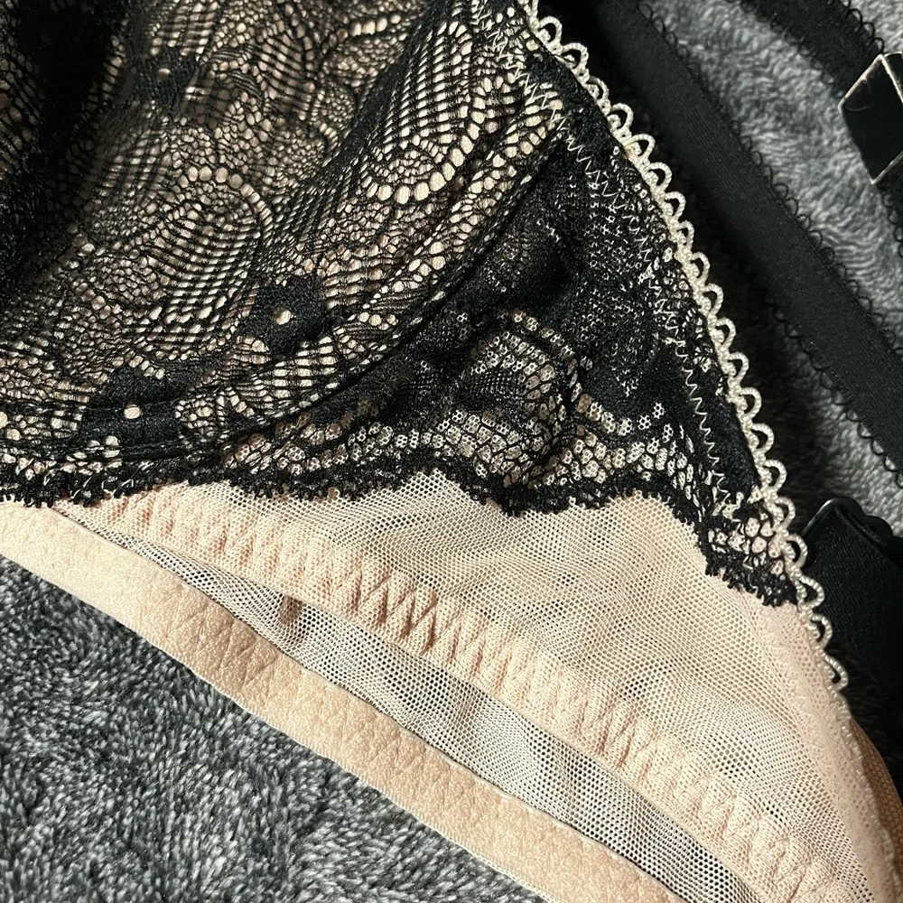 BLACKHEART bra new with partial tags.  Black and nude color. Underwire. 36B